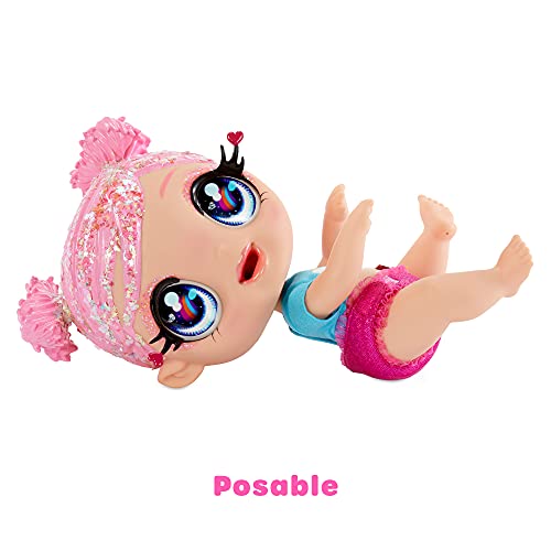 MGA Entertainment Glitter Babyz Muñeca Dreamia Stardust con 3 Cambios de Color mágicos, Pelo Rosa y Vestido arcoíris, Incluye pañal, biberón y Chupete Reutilizables, Edad: 3+ años