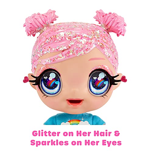 MGA Entertainment Glitter Babyz Muñeca Dreamia Stardust con 3 Cambios de Color mágicos, Pelo Rosa y Vestido arcoíris, Incluye pañal, biberón y Chupete Reutilizables, Edad: 3+ años